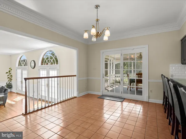 a bathroom with a bathtub sink and mirror