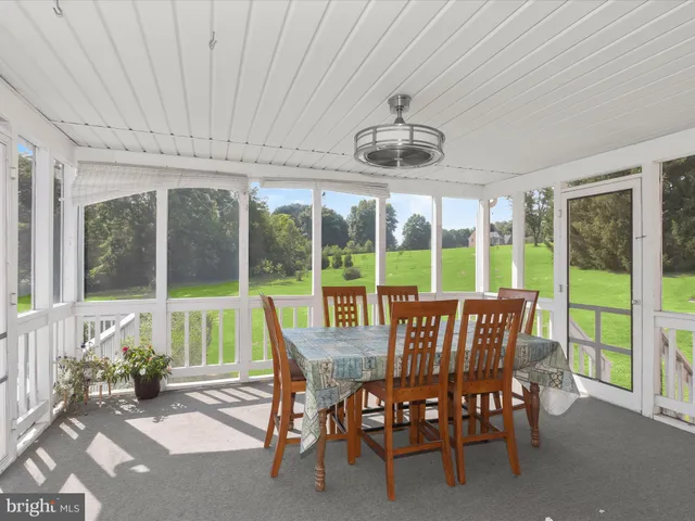 a spacious bathroom with a granite countertop sink mirror and shower