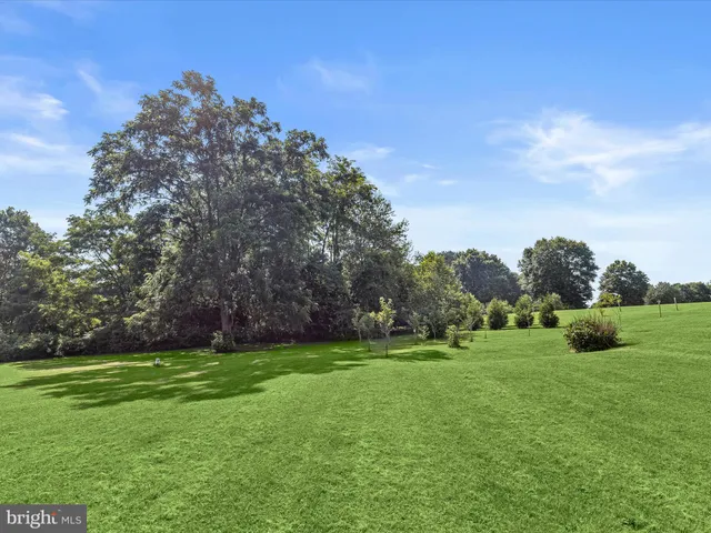 an empty room with furniture and a window