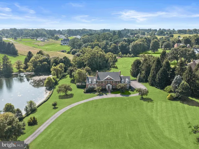 a view of entryway and hall with a living room