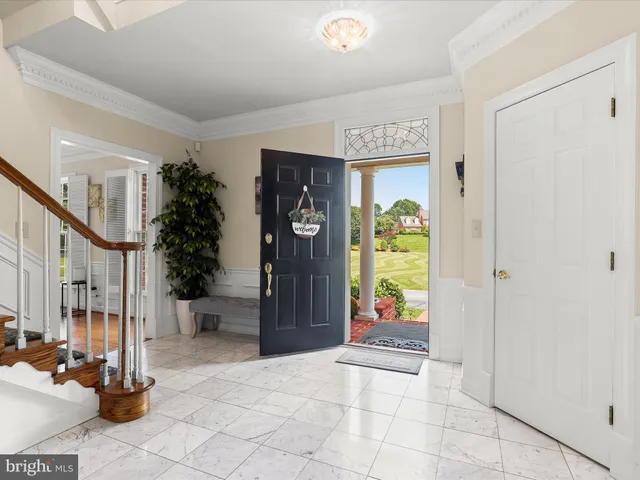 a view of a dining room with furniture wooden floor and chandelier