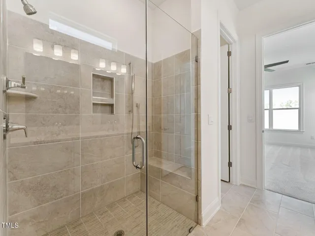 a bathroom with a shower and a sink