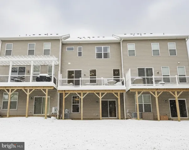 a front view of a house with a outdoor space
