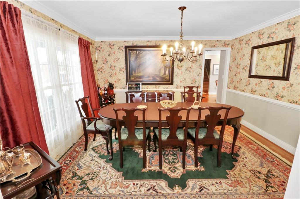 2776 Valleyview Drive Lower Burrell, PA 15068 - Photo 13 of 50 a view of a a dining room with furniture window and wooden floor