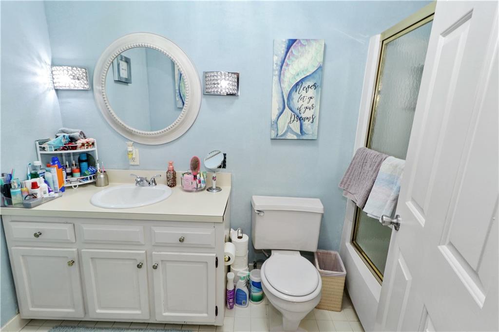2776 Valleyview Drive Lower Burrell, PA 15068 - Photo 36 of 50 a bathroom with a toilet a sink and a mirror