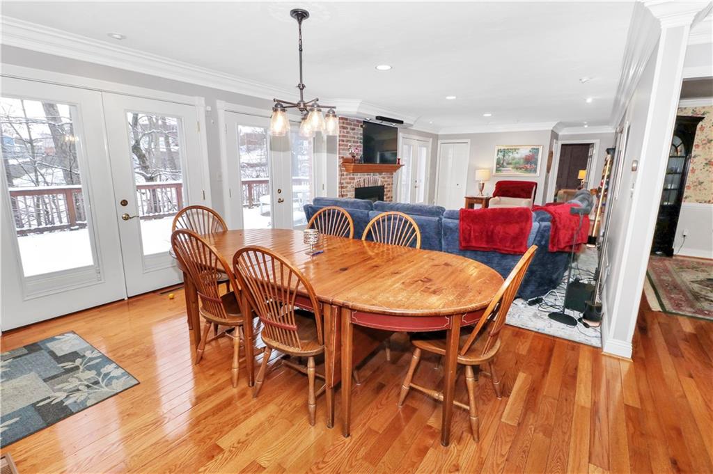 2776 Valleyview Drive Lower Burrell, PA 15068 - Photo 8 of 47 Dining overing look the family room showcasing wall of windows that over look the estate.
