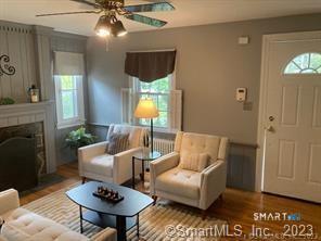 121 Clark Street Milford, CT 06460 - Photo 4 of 35 a living room with furniture and a fireplace