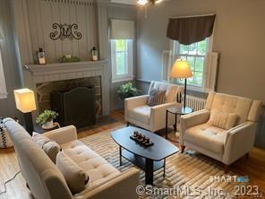 121 Clark Street Milford, CT 06460 - Photo 5 of 35 a living room with furniture and a fireplace