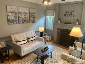 121 Clark Street Milford, CT 06460 - Photo 6 of 35 a living room with furniture and a lamp