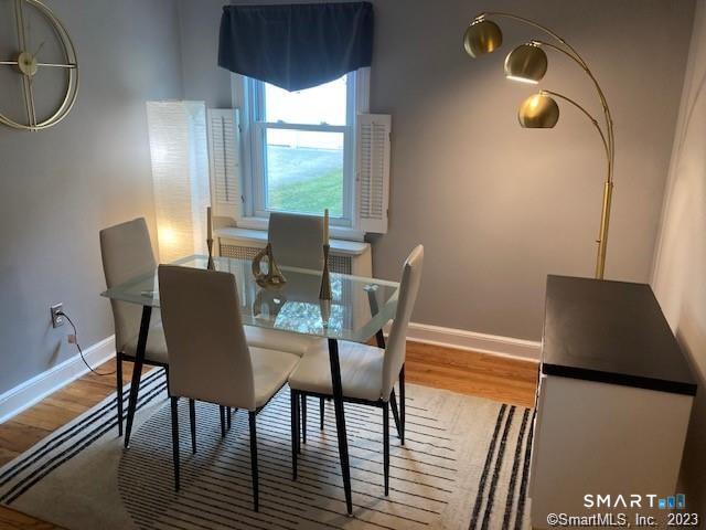 121 Clark Street Milford, CT 06460 - Photo 8 of 35 a view of a dining room with furniture window and wooden floor