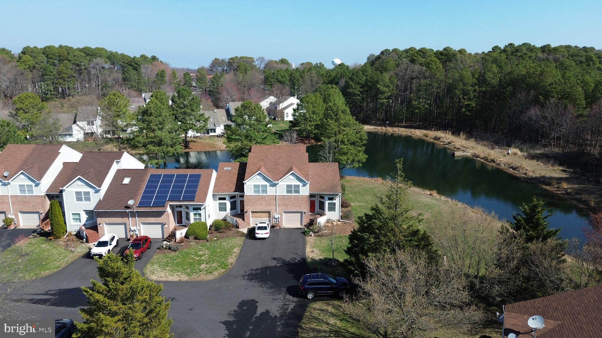 7009 Bridgepointe Drive Chester, MD 21619 - Photo 12 of 41 an aerial view of a house with a garden and lake view