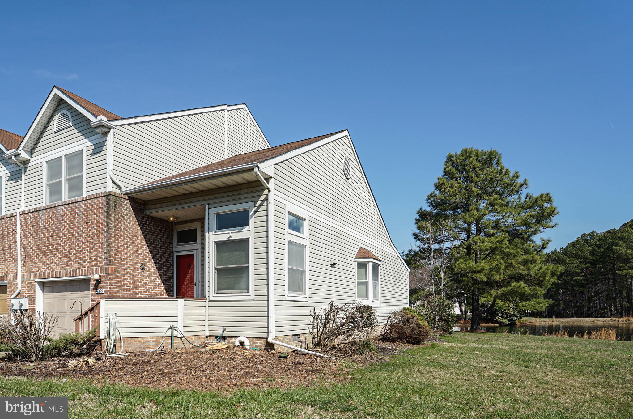7009 Bridgepointe Drive Chester, MD 21619 - Photo 13 of 41 a front view of a house with garden