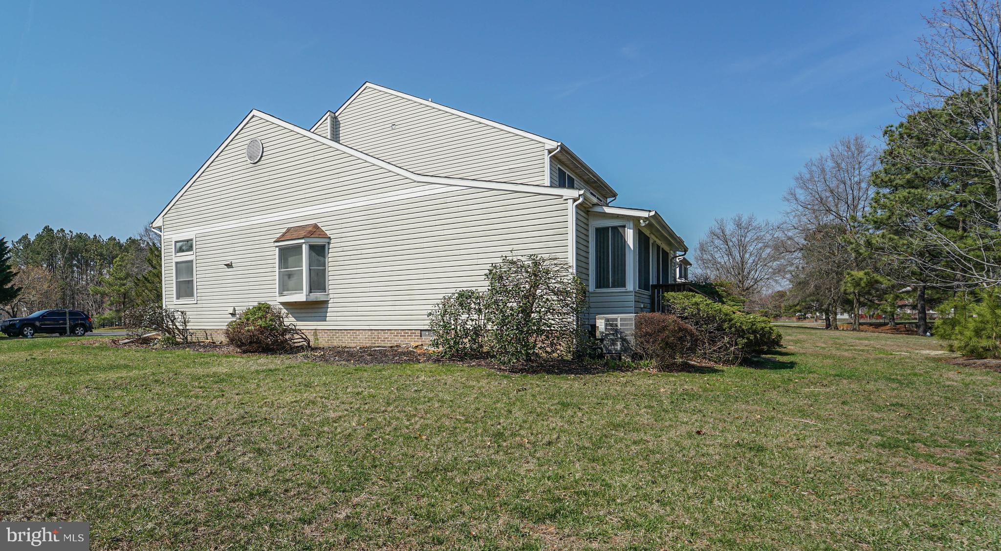 7009 Bridgepointe Drive Chester, MD 21619 - Photo 14 of 41 a view of a house with a yard