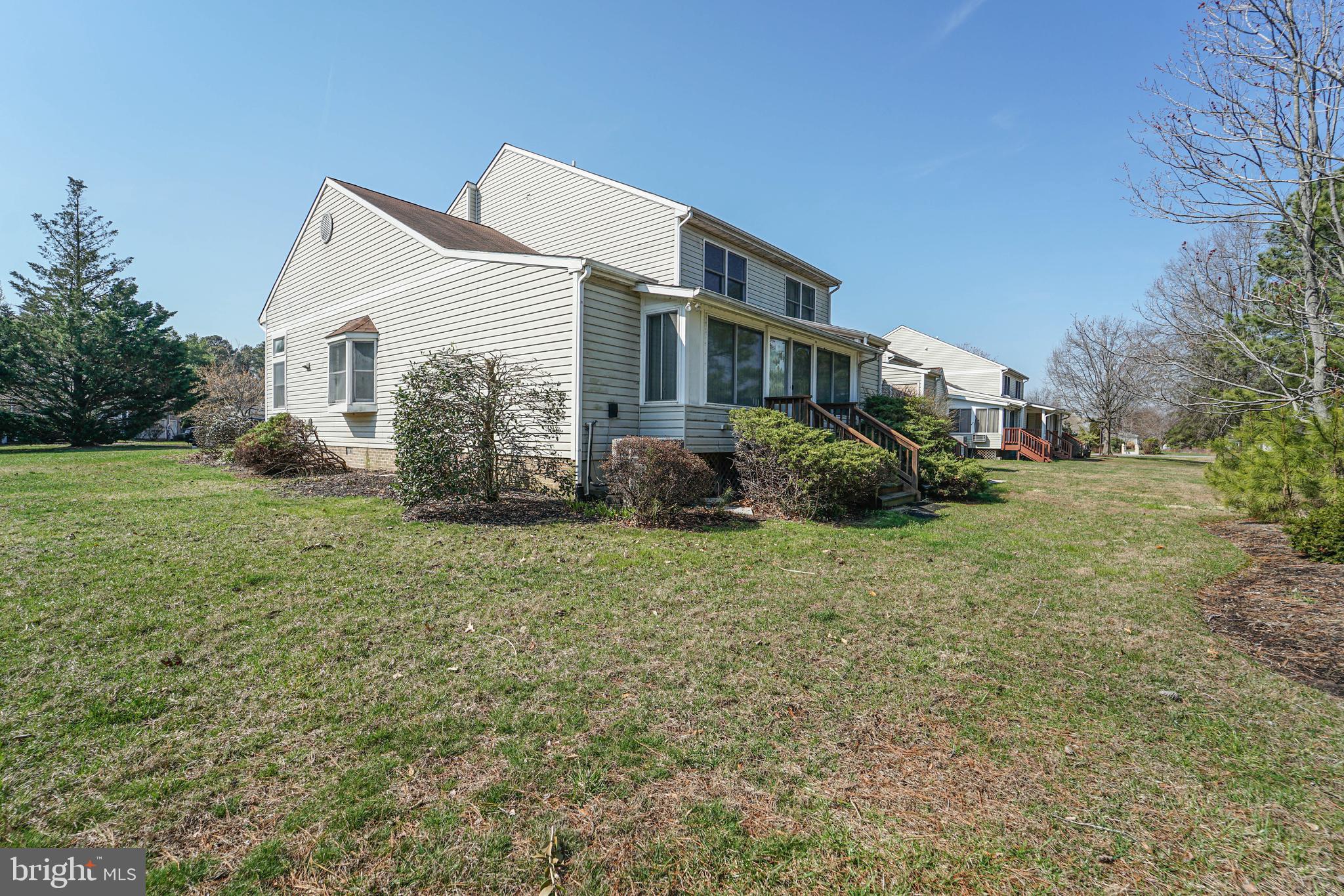 7009 Bridgepointe Drive Chester, MD 21619 - Photo 15 of 41 a view of a house with a yard