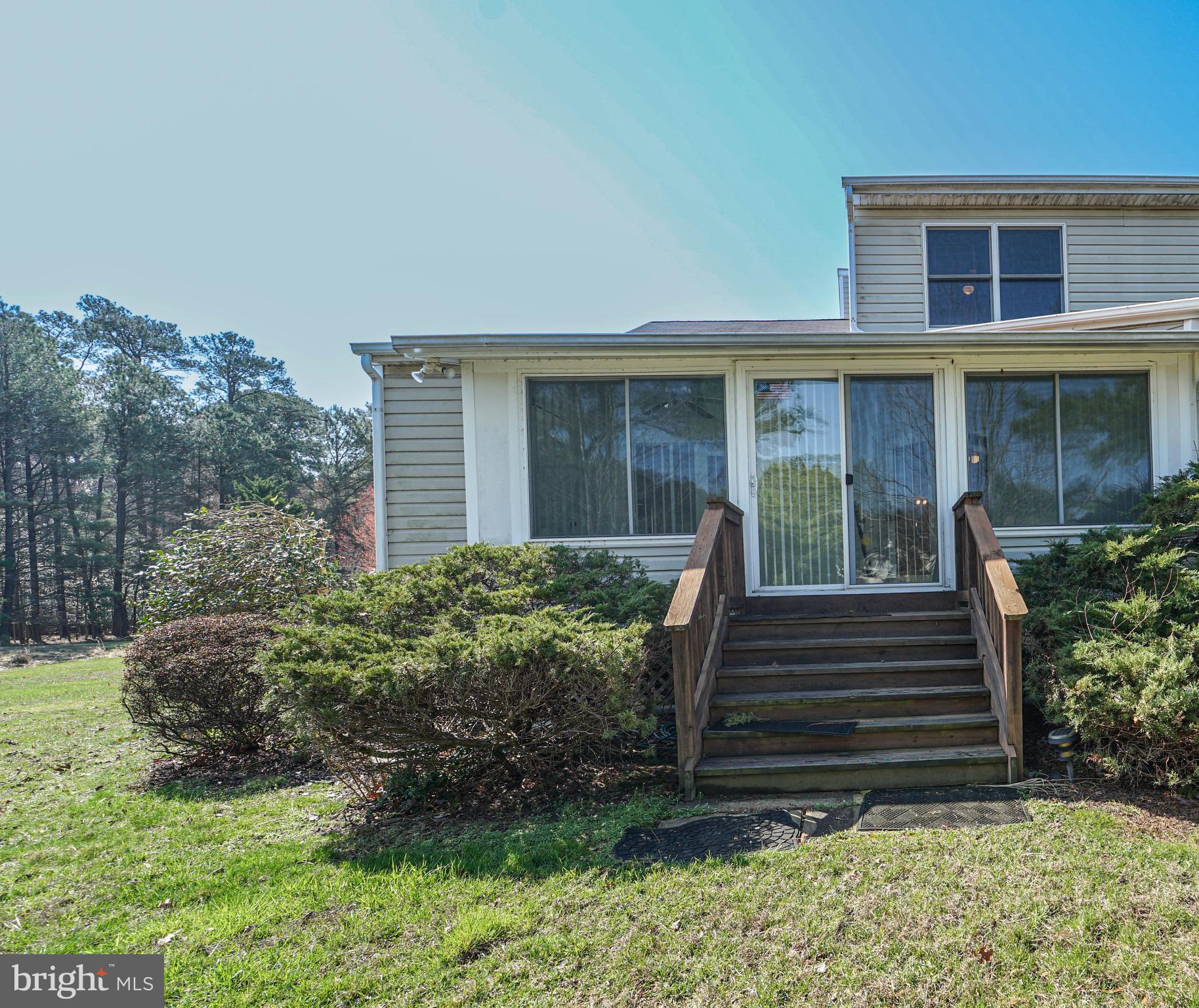 7009 Bridgepointe Drive Chester, MD 21619 - Photo 16 of 41 a front view of a house with a yard