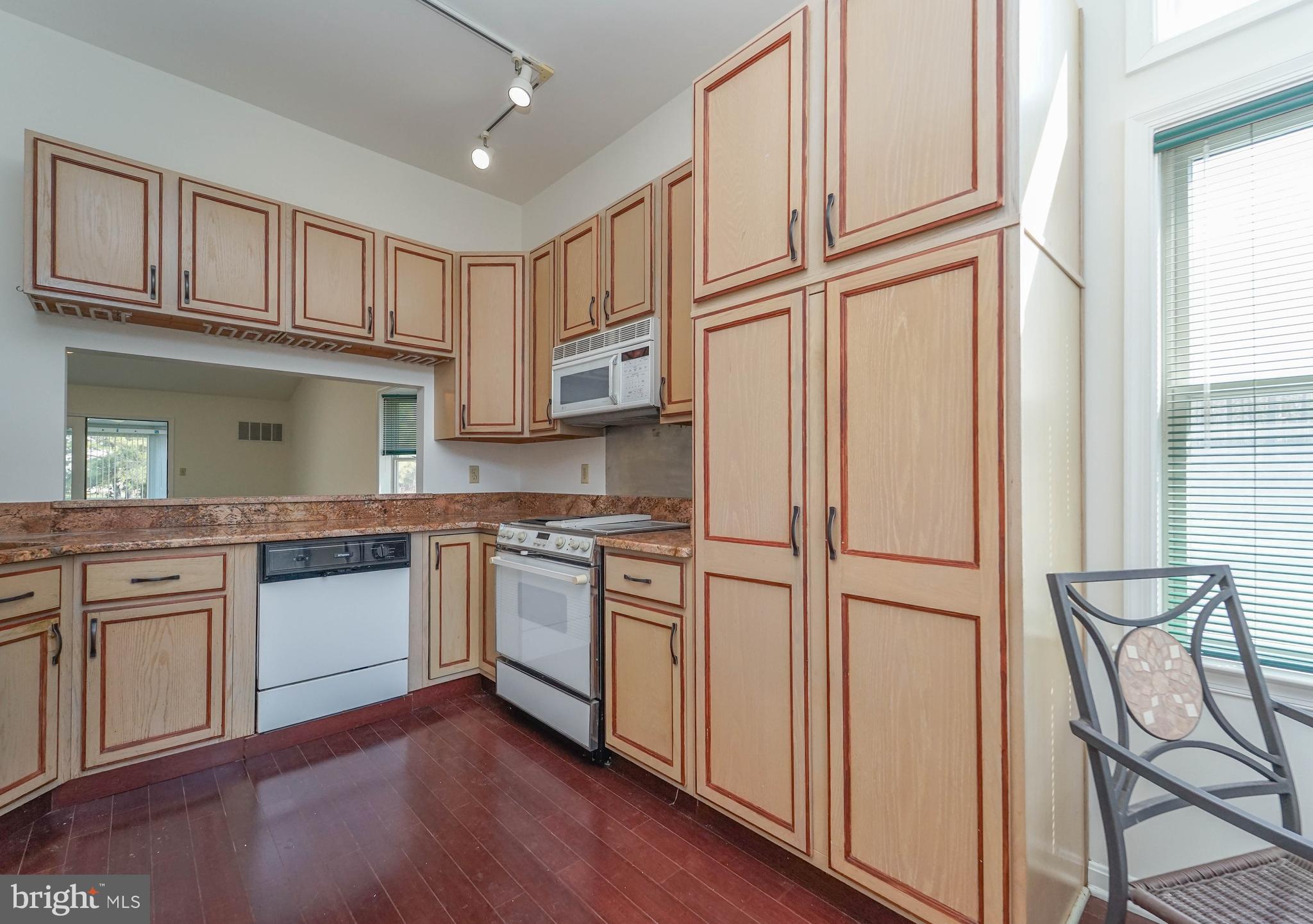 7009 Bridgepointe Drive Chester, MD 21619 - Photo 19 of 41 a kitchen with stainless steel appliances granite countertop a refrigerator and a stove top oven