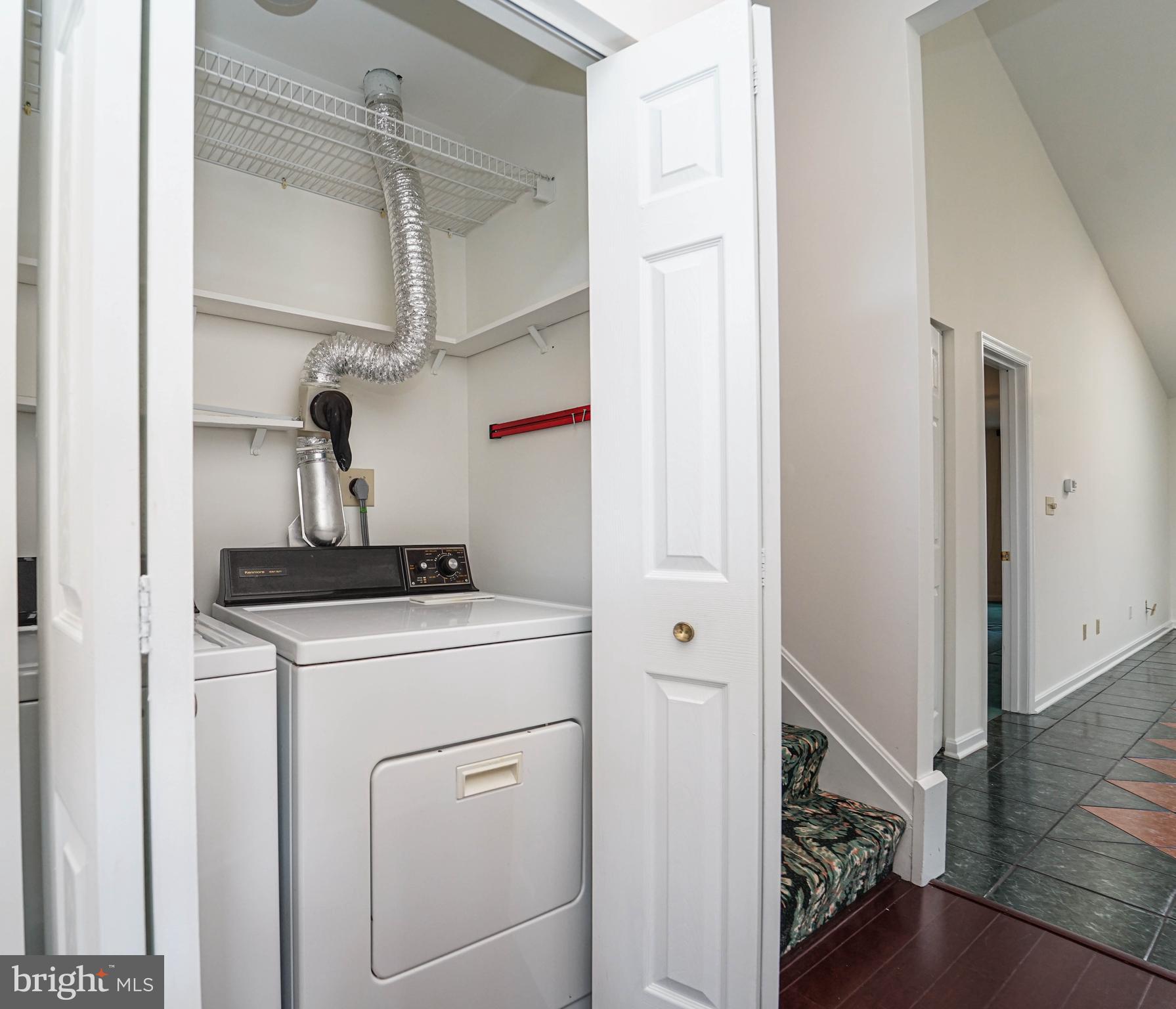 7009 Bridgepointe Drive Chester, MD 21619 - Photo 22 of 41 a view of storage and utility room with washer and dryer
