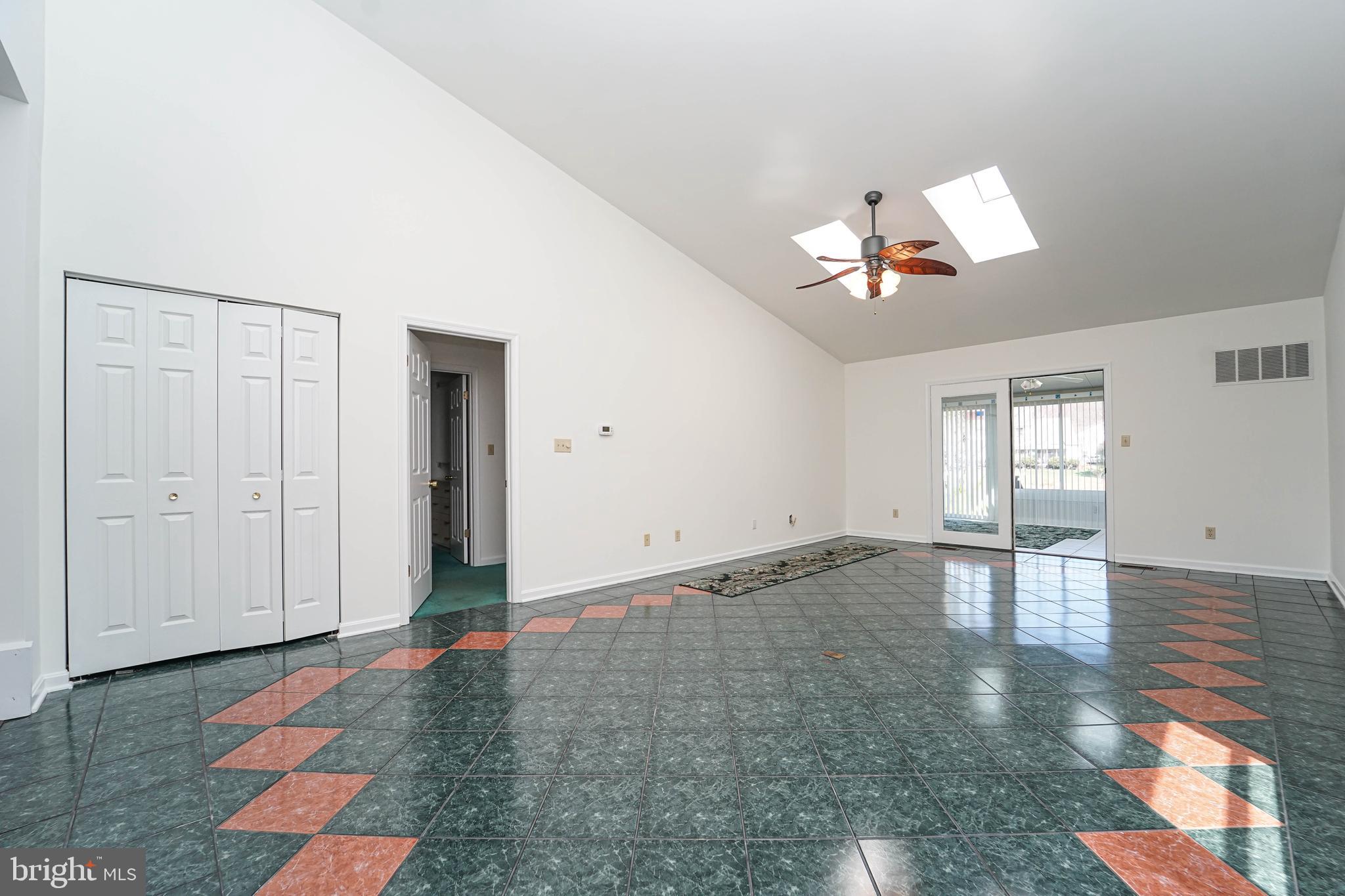 7009 Bridgepointe Drive Chester, MD 21619 - Photo 24 of 41 wooden floor in an empty room with a window