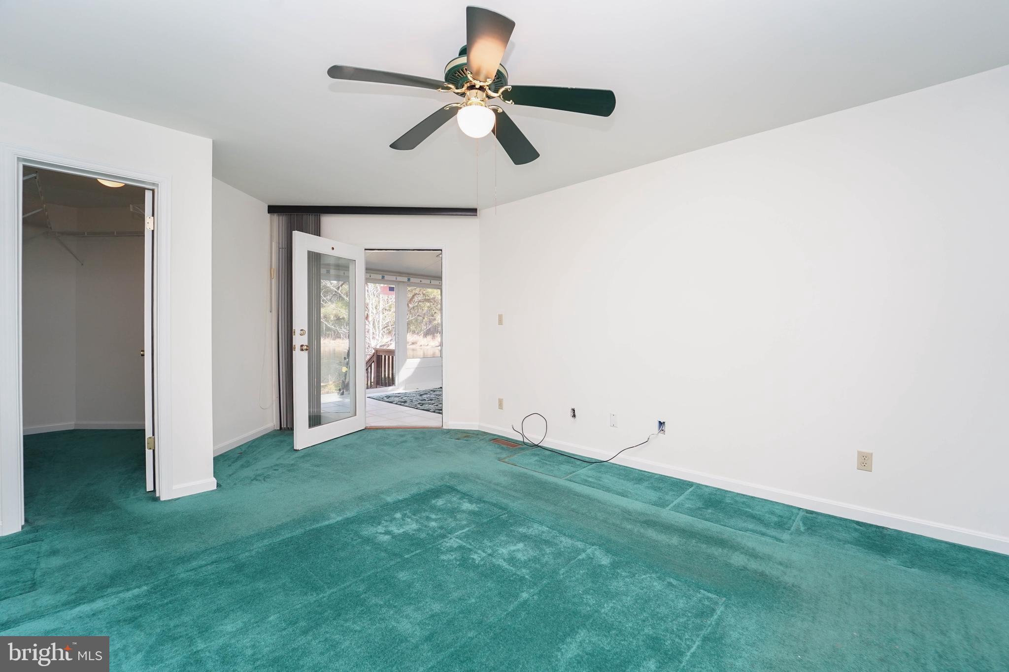 7009 Bridgepointe Drive Chester, MD 21619 - Photo 32 of 41 a view of room with window and a ceiling fan