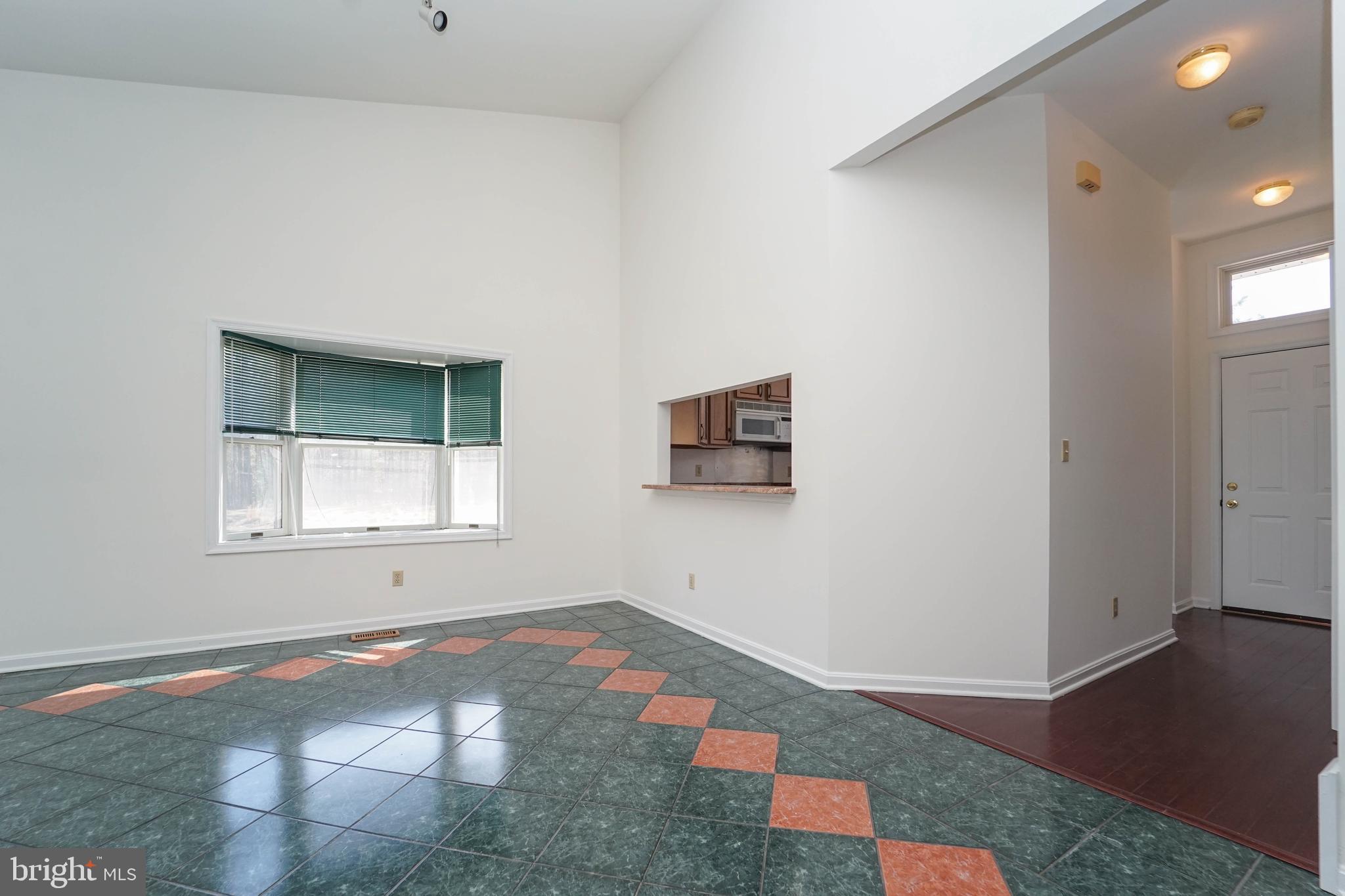 7009 Bridgepointe Drive Chester, MD 21619 - Photo 35 of 41 an empty room with windows