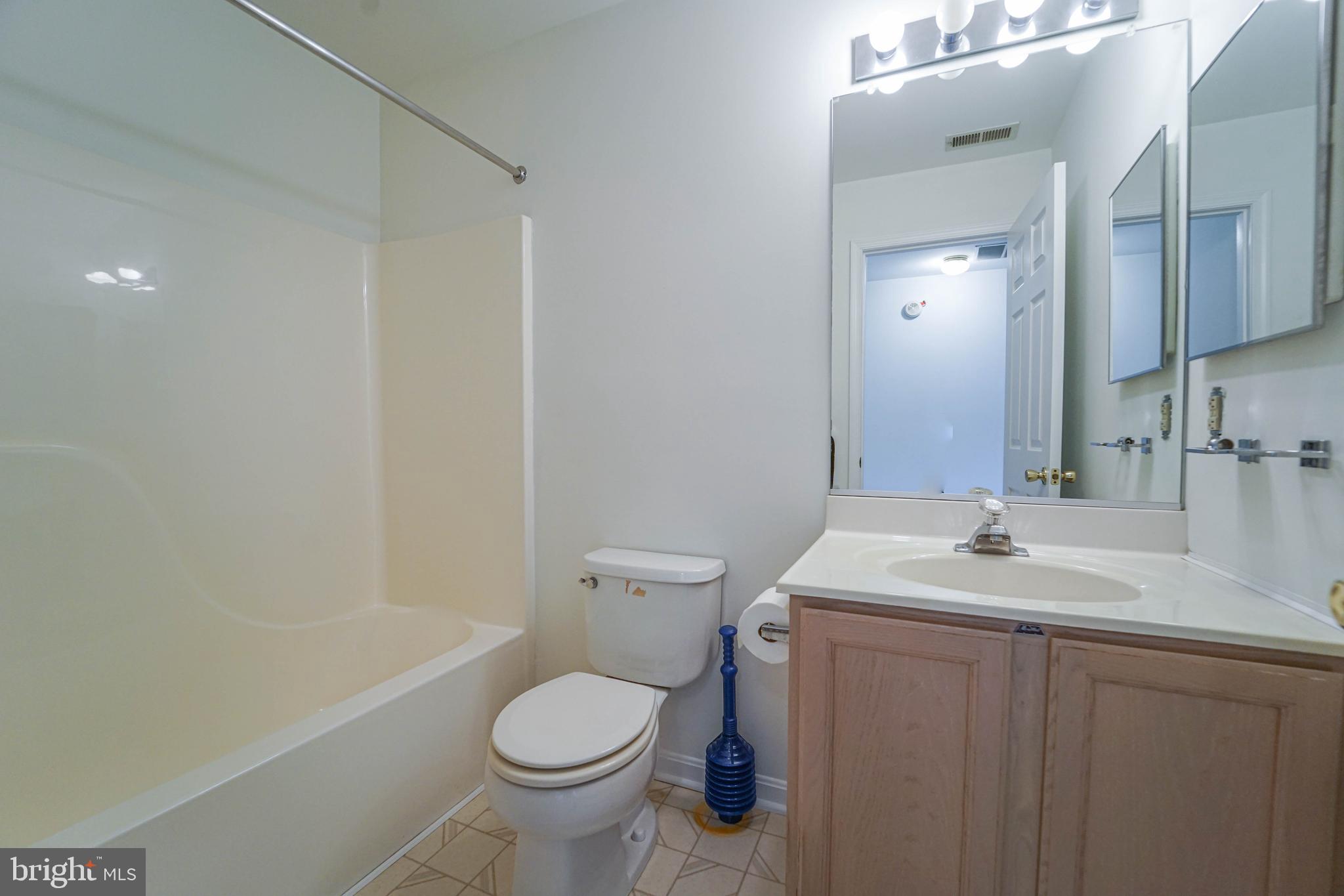 7009 Bridgepointe Drive Chester, MD 21619 - Photo 39 of 41 a bathroom with a sink toilet and shower