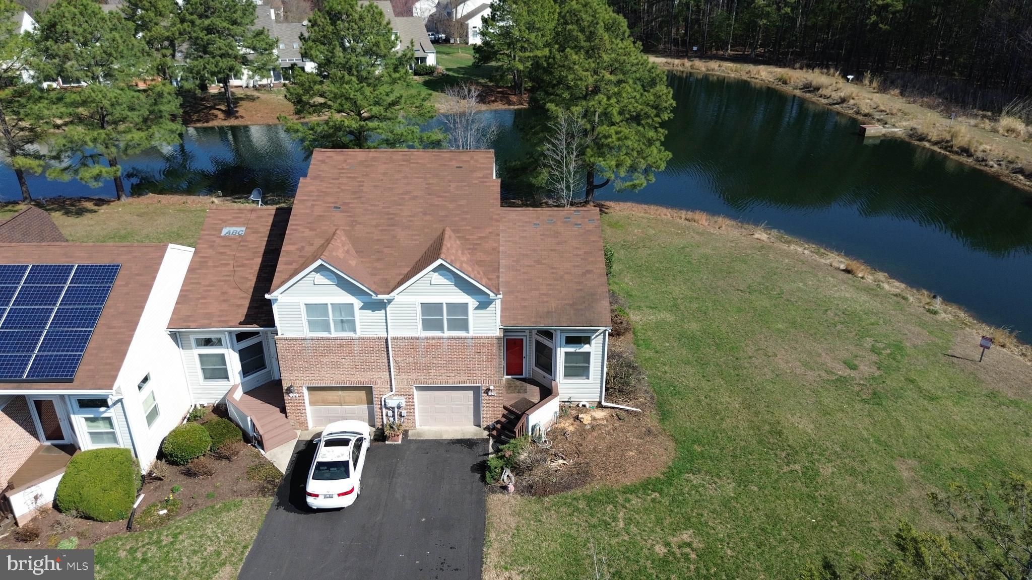 7009 Bridgepointe Drive Chester, MD 21619 - Photo 5 of 41 an aerial view of a house with garden space and lake view