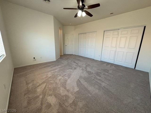 2866 Shimmering Bay Street Laughlin, NV 89029 - Photo 15 of 32 A spacious, naturally illuminated bedroom offers comfort with plush carpeting and ample storage.