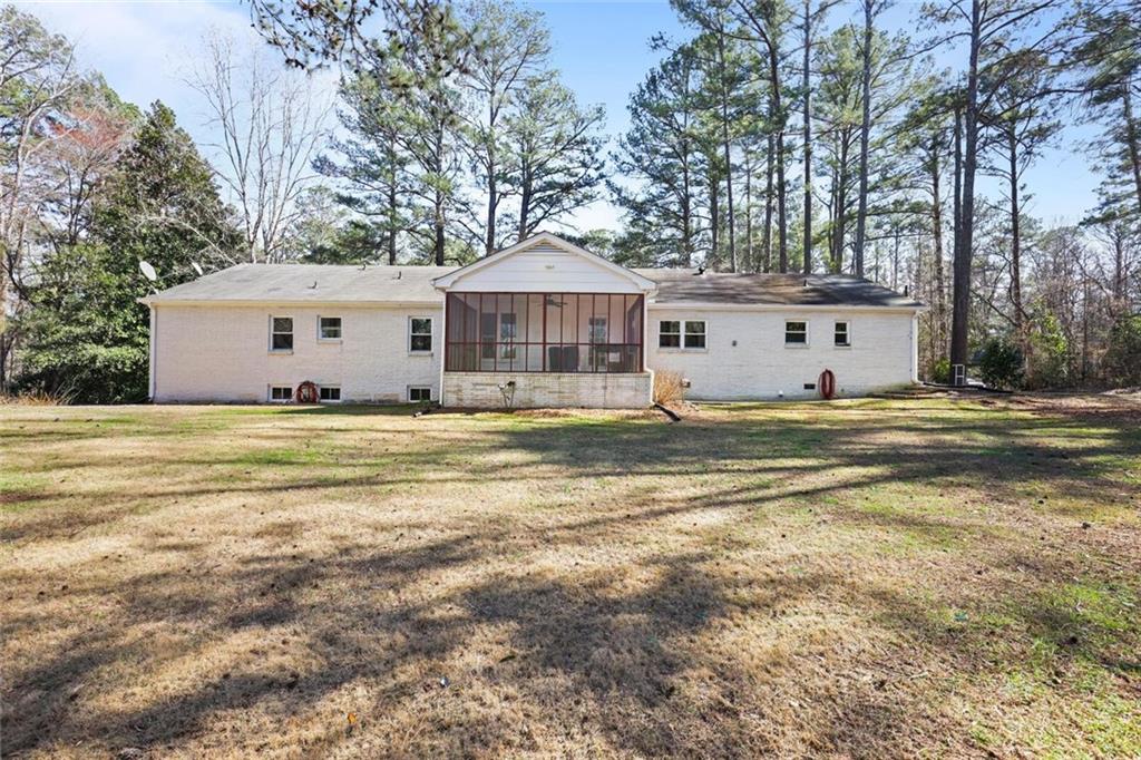 4505 Cochran Mill Road Fairburn, GA 30213 - Photo 31 of 36 a house that has a tree in front of it