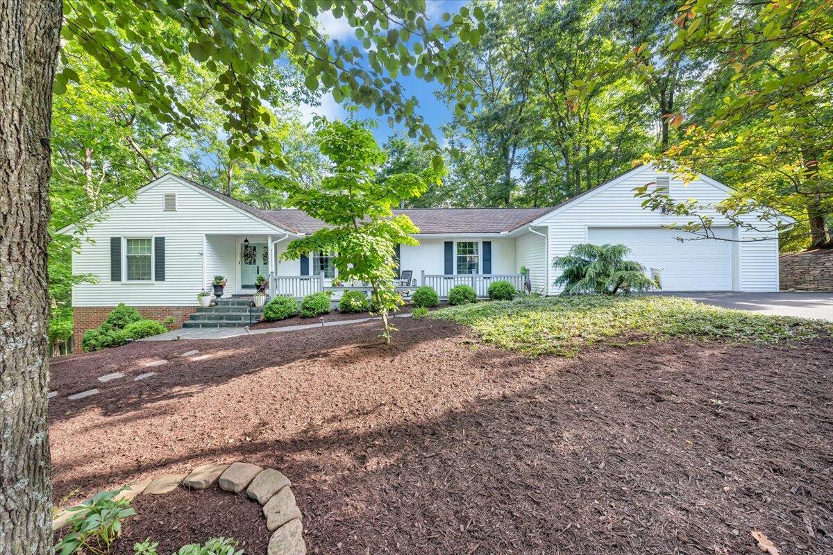 5249 Falcon Ridge Road Roanoke, VA 24018 - Photo 1 of 58 a front view of a house with a yard and garage