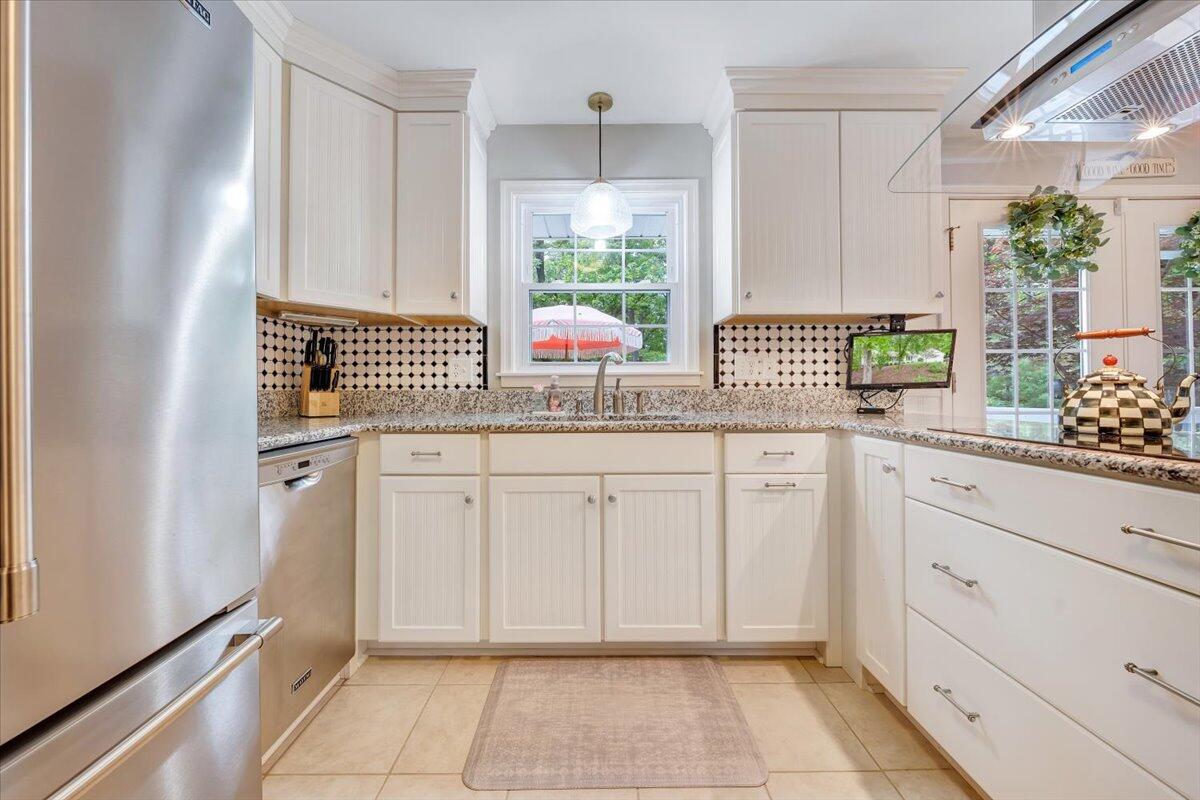 5249 Falcon Ridge Road Roanoke, VA 24018 - Photo 17 of 58 a kitchen with white cabinets and window