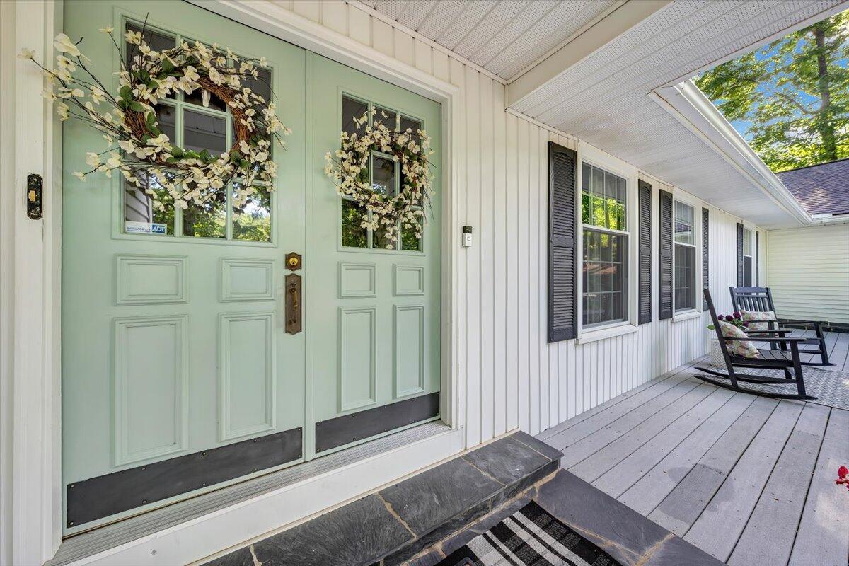 5249 Falcon Ridge Road Roanoke, VA 24018 - Photo 2 of 58 a view of a balcony with chairs and wooden floor
