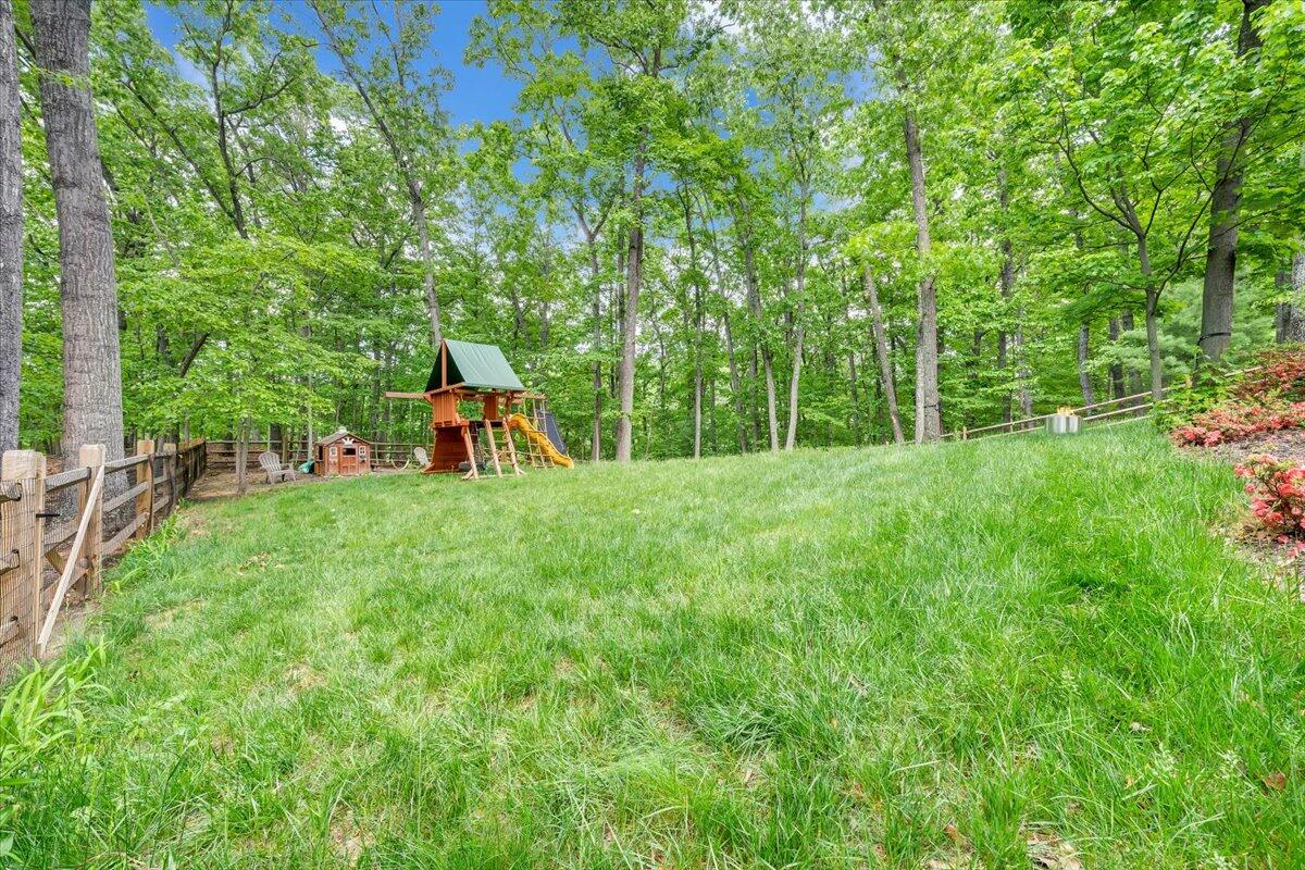 5249 Falcon Ridge Road Roanoke, VA 24018 - Photo 51 of 58 a view of a backyard with a garden and trees