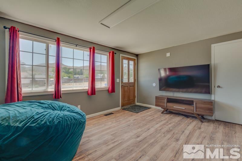 8605 Channel Reno, NV 89506 - Photo 5 of 21 a living room with a flat screen tv and a window