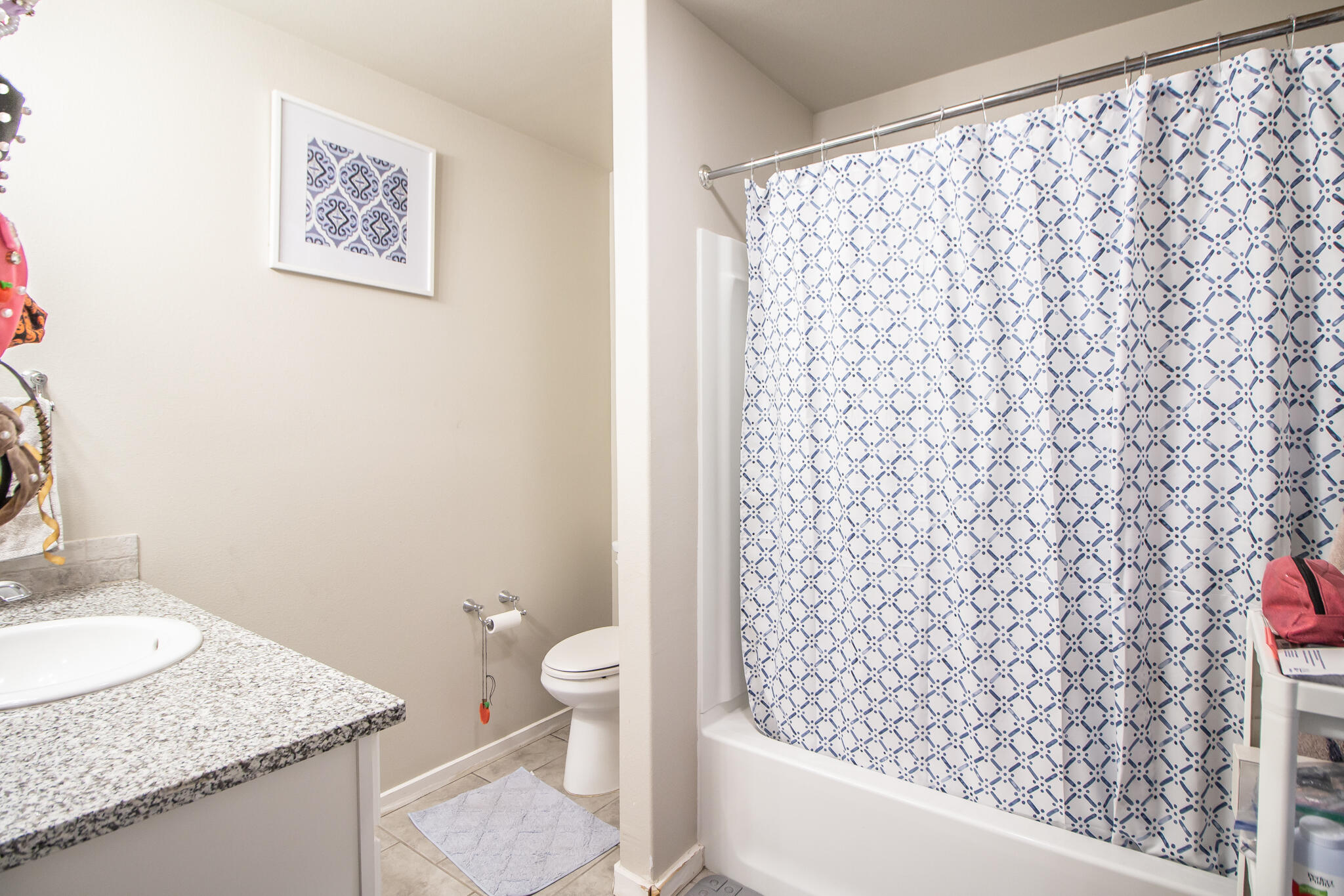 2908 Waverly Avenue Lubbock, TX 79407 - Photo 13 of 22 a bathroom with a granite countertop sink and a toilet