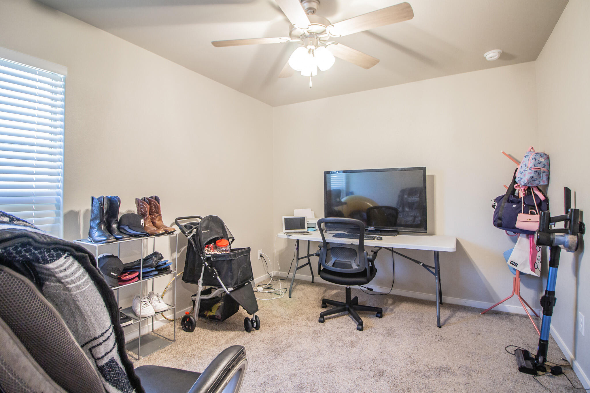 2908 Waverly Avenue Lubbock, TX 79407 - Photo 16 of 22 a view of a workspace with furniture and a window