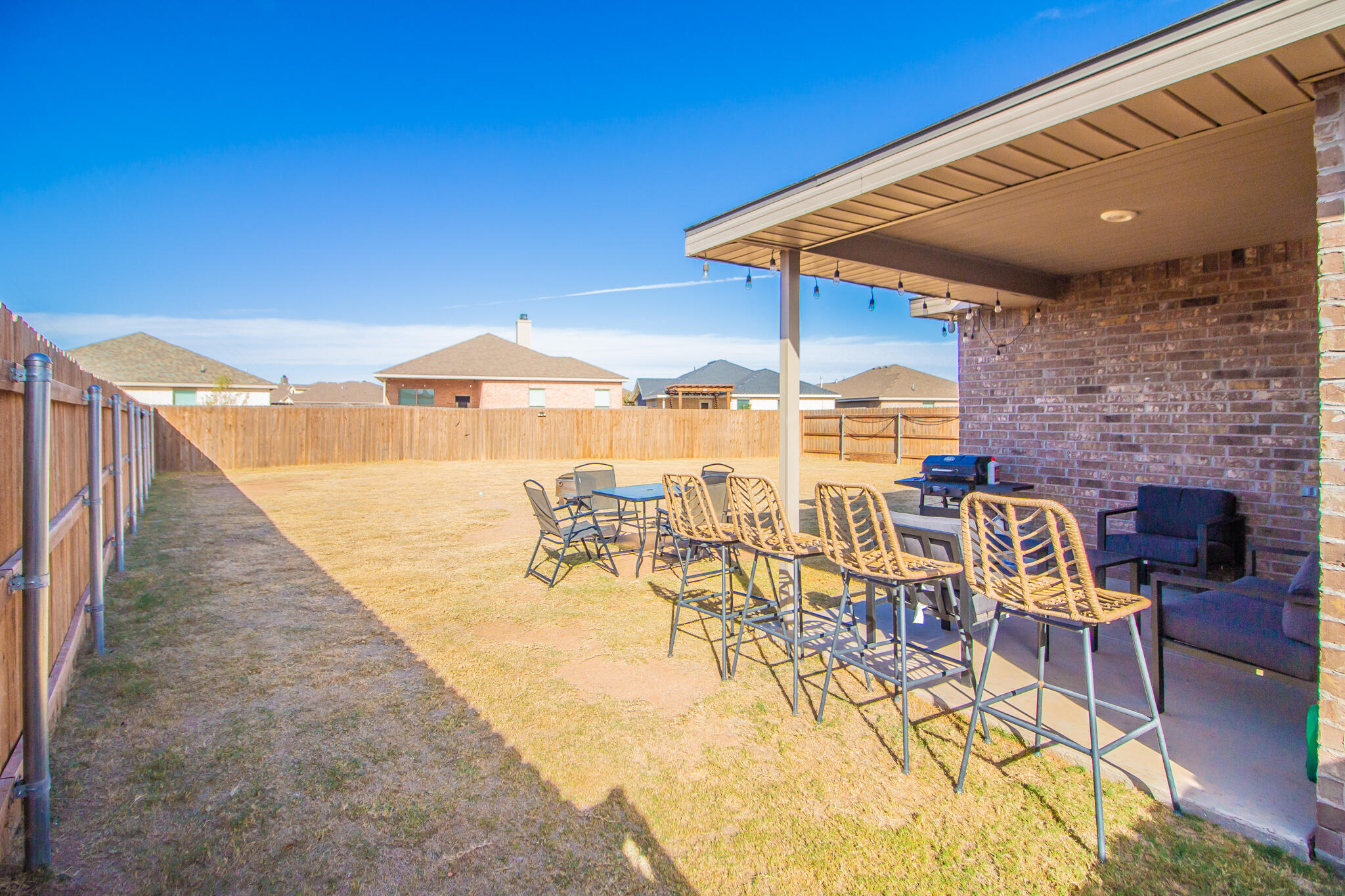 2908 Waverly Avenue Lubbock, TX 79407 - Photo 20 of 22 a patio with glass top table and chairs