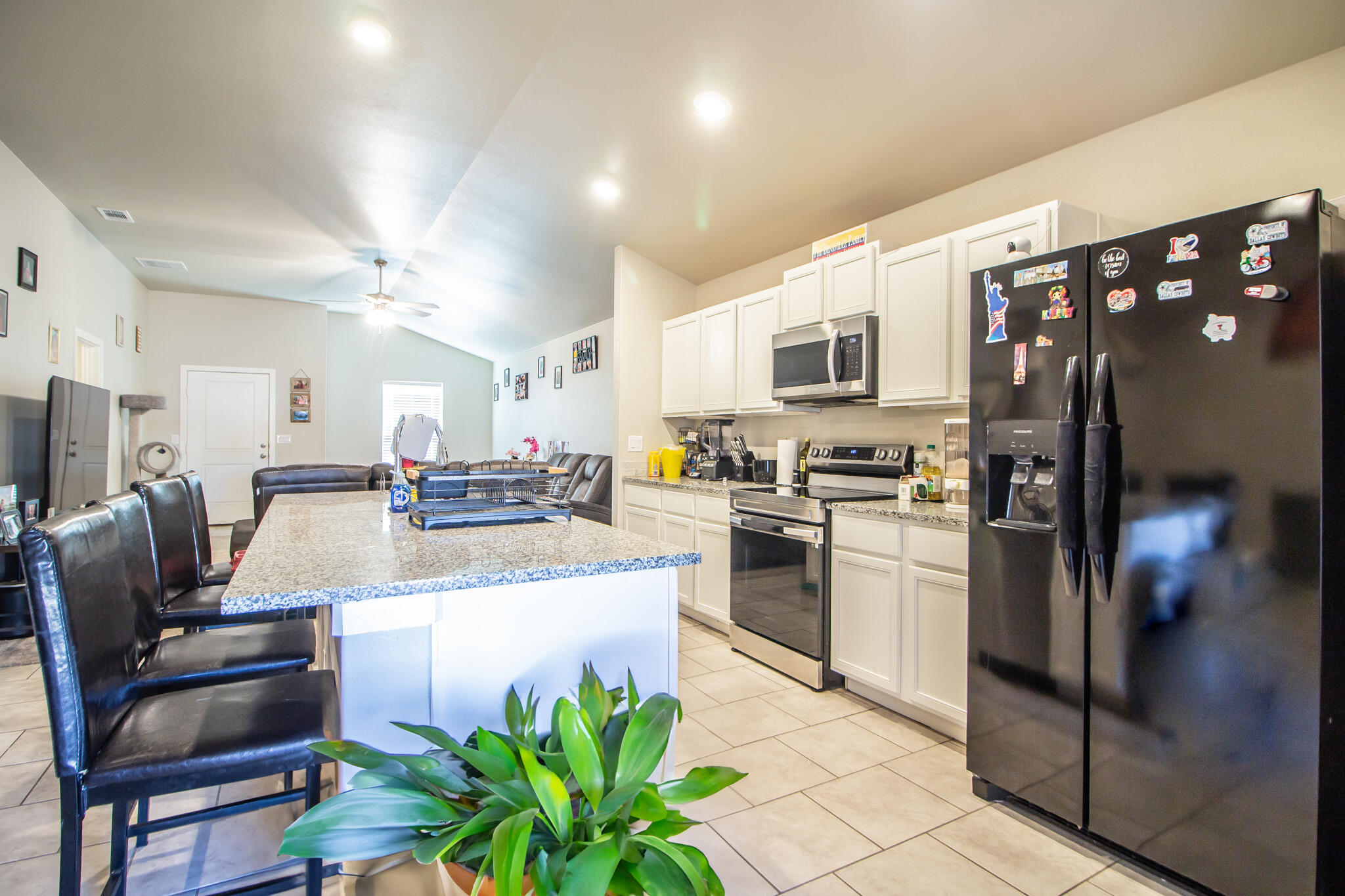 2908 Waverly Avenue Lubbock, TX 79407 - Photo 3 of 22 a view of kitchen with refrigerator stove microwave and cabinets