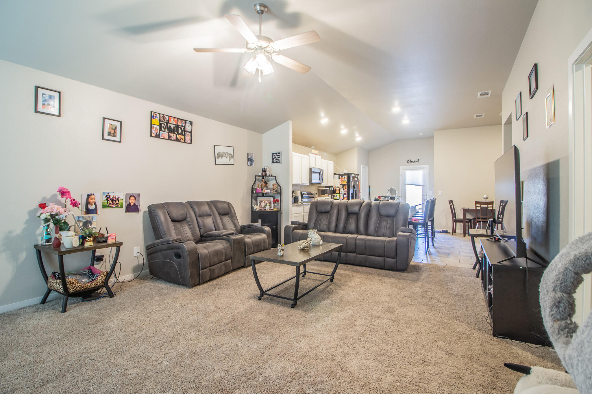 2908 Waverly Avenue Lubbock, TX 79407 - Photo 6 of 22 a living room with furniture and a chandelier