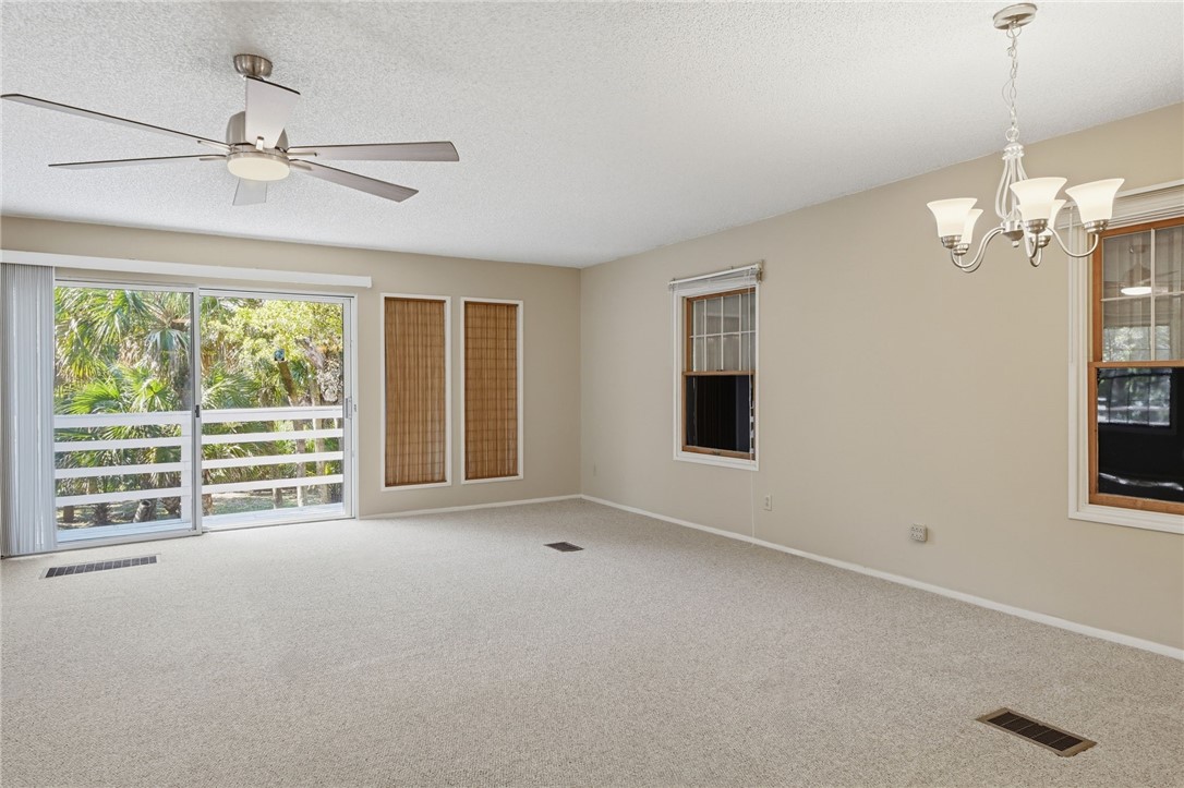 1951 West Shell Lane Vero Beach, FL 32963 - Photo 13 of 35 a view of livingroom with window ceiling fan and windows