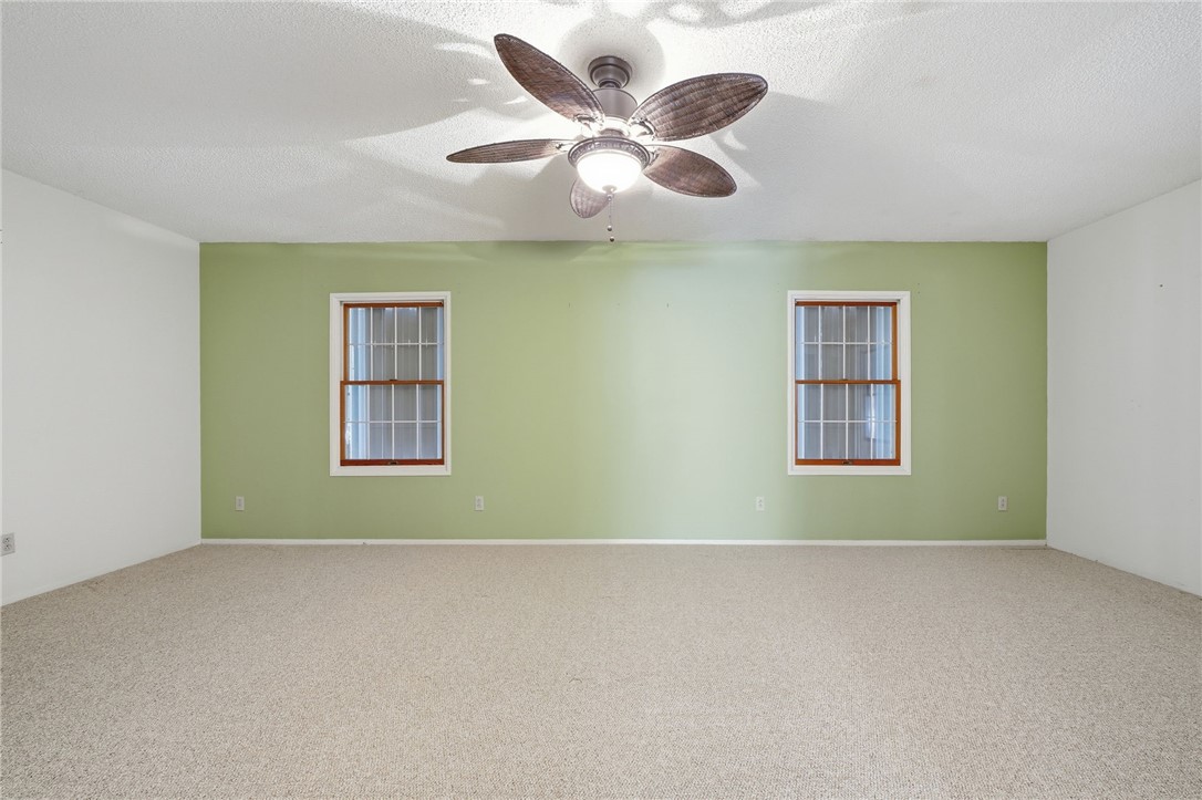 1951 West Shell Lane Vero Beach, FL 32963 - Photo 17 of 35 an empty room with ceiling fan and window