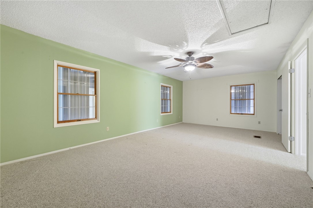 1951 West Shell Lane Vero Beach, FL 32963 - Photo 19 of 35 an empty room with windows and fan