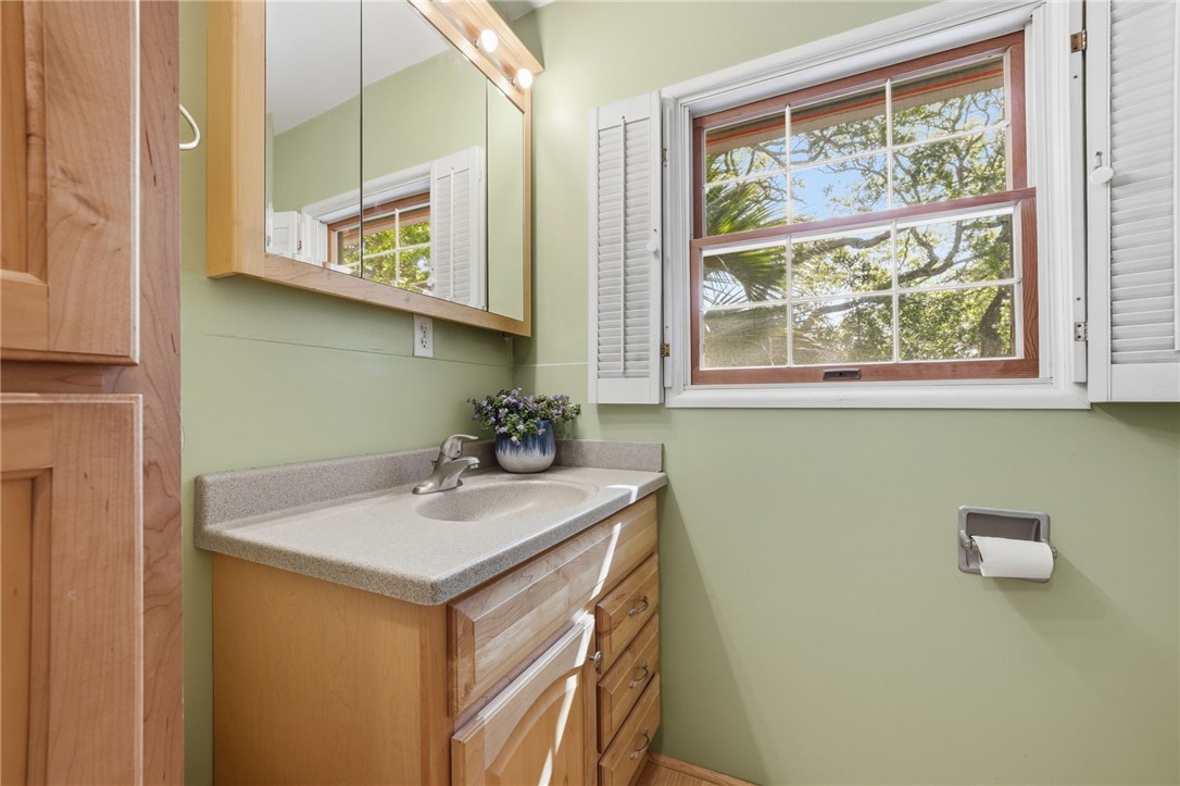 1951 West Shell Lane Vero Beach, FL 32963 - Photo 21 of 35 a bathroom with a sink and a mirror