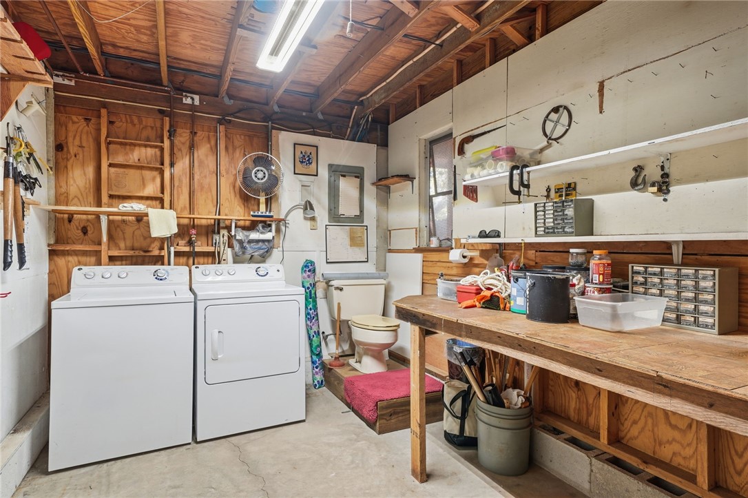 1951 West Shell Lane Vero Beach, FL 32963 - Photo 29 of 35 a utility room with dryer and washer
