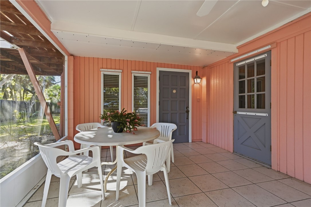 1951 West Shell Lane Vero Beach, FL 32963 - Photo 3 of 35 a dining room with furniture and large windows
