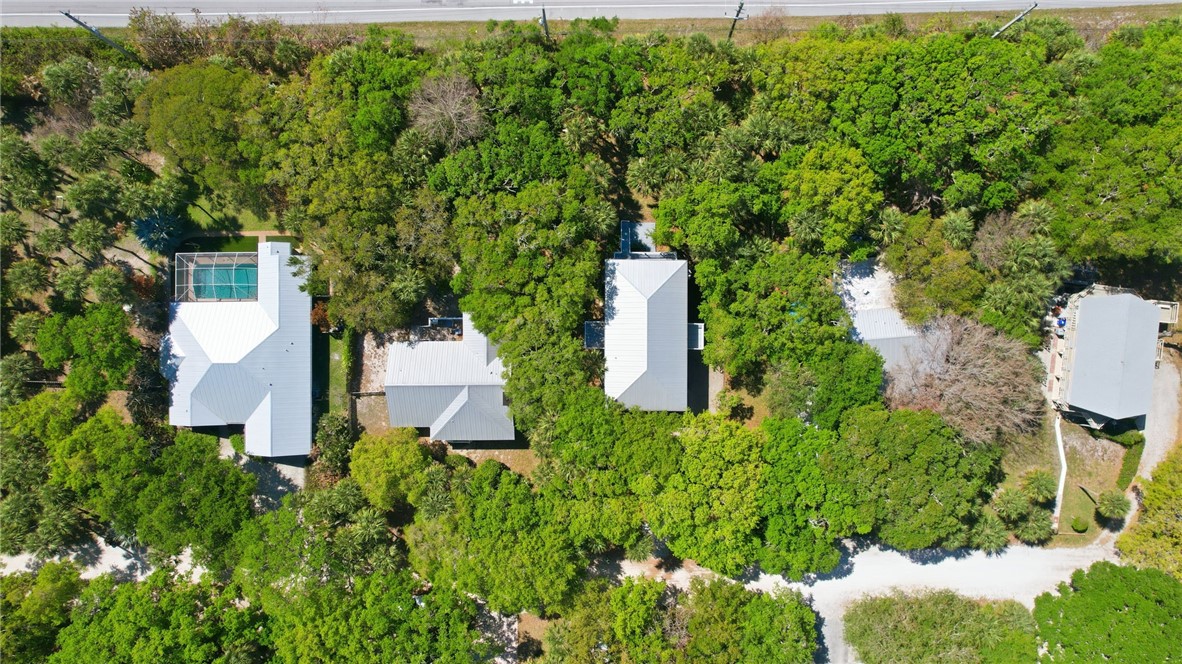 1951 West Shell Lane Vero Beach, FL 32963 - Photo 32 of 35 an aerial view of residential house with outdoor space and trees all around