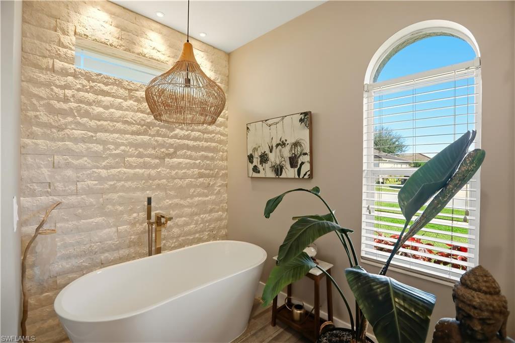80 Delbrook Way Marco Island, FL 34145 - Photo 21 of 49 Full bathroom with a soaking tub