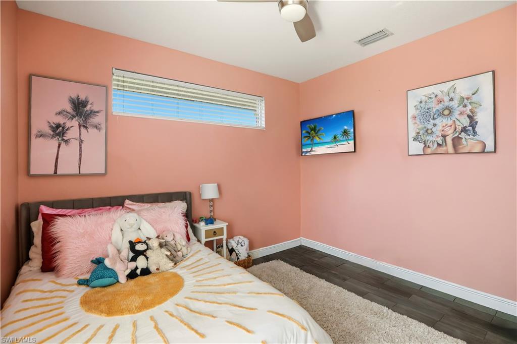 80 Delbrook Way Marco Island, FL 34145 - Photo 27 of 49 Bedroom with dark wood-style floors and a ceiling fan