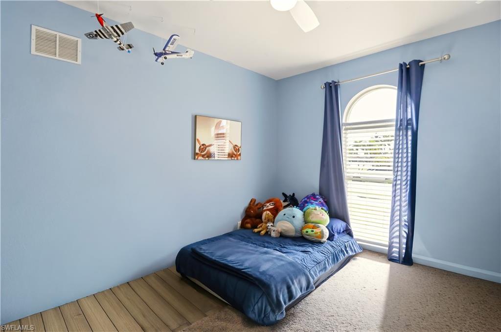 80 Delbrook Way Marco Island, FL 34145 - Photo 28 of 49 Bedroom featuring ceiling fan and carpet floors