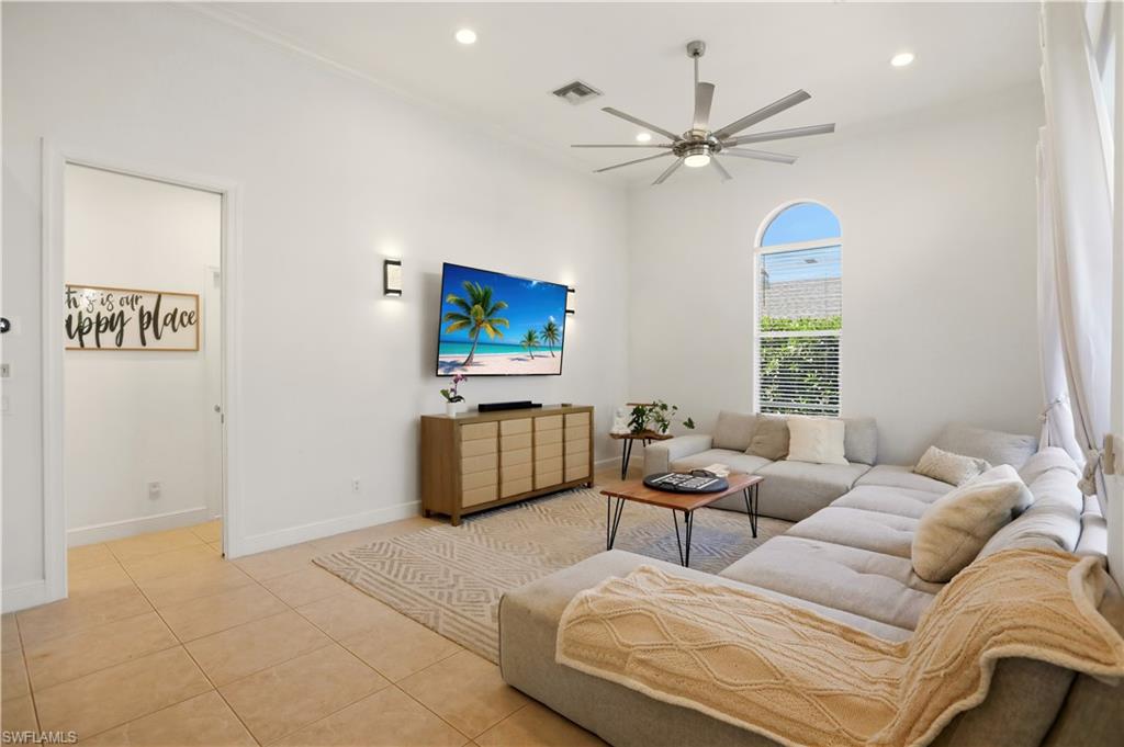 80 Delbrook Way Marco Island, FL 34145 - Photo 10 of 49 Living area featuring tile patterned flooring, recessed lighting, and a ceiling fan