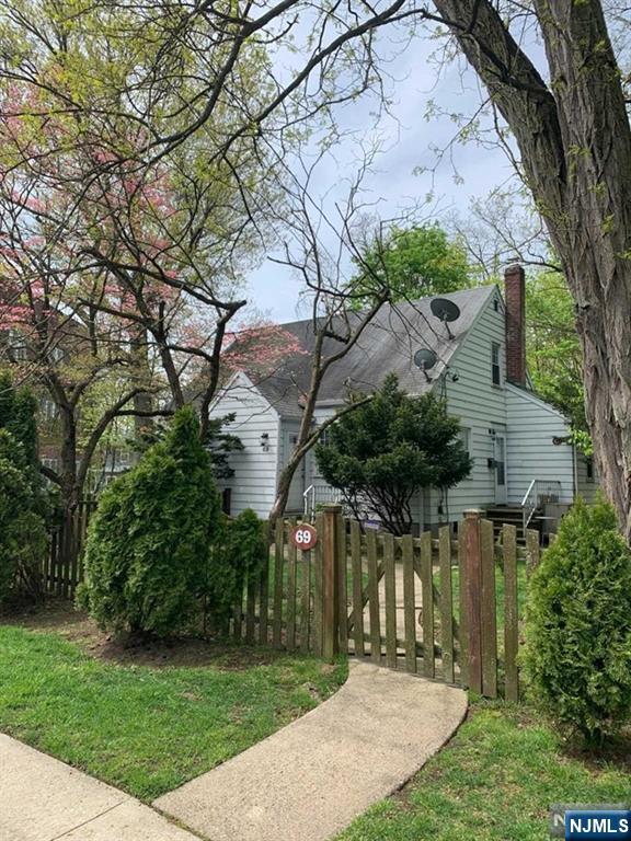69 County Road Cresskill, NJ 07626 - Photo 2 of 20 a view of a house with a small yard